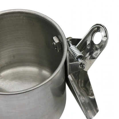 Close-up of the cup's inside, showing the nut and the spring-loaded metal clip on its outer wall. 3