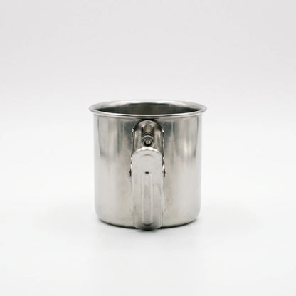 Rear view of a steel cup showing the metal clip fastened to its side, against a plain background. 4