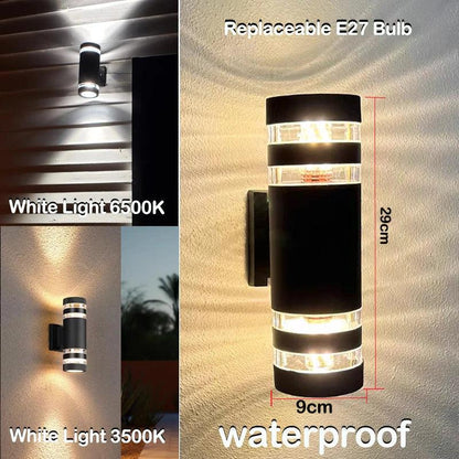 Long black cylindrical wall light with clear banded ends, dimensions marked, shown glowing in white and warm light on a wall. 9