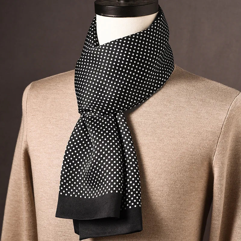 Black silk scarf with fine white polka dots and plain black ends, draped on a mannequin in a beige jumper. 14