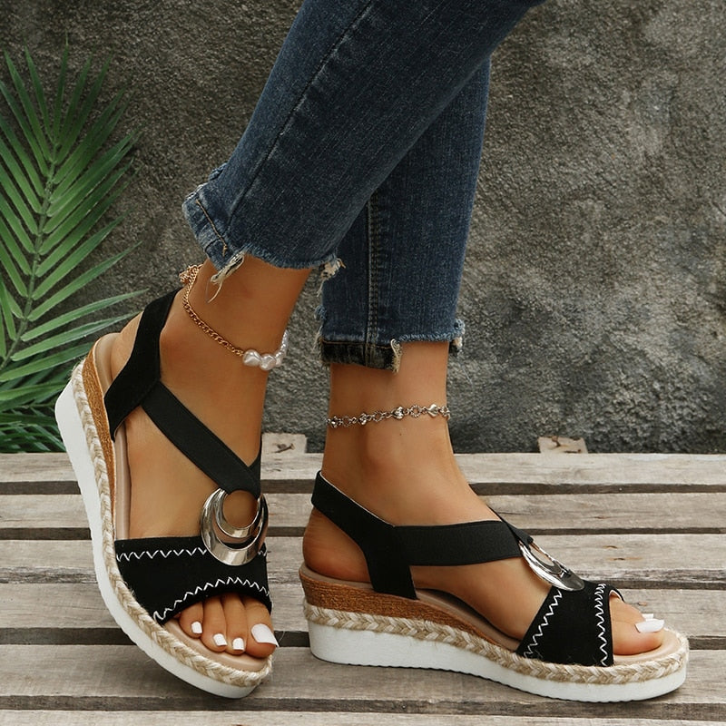 Wedge-heeled sandals with snakeskin print – Viperra