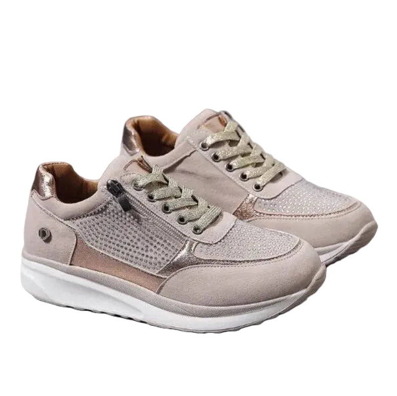 Pair of beige lace-up trainers with side zip, sparkly studded panels and white chunky soles on white background 1