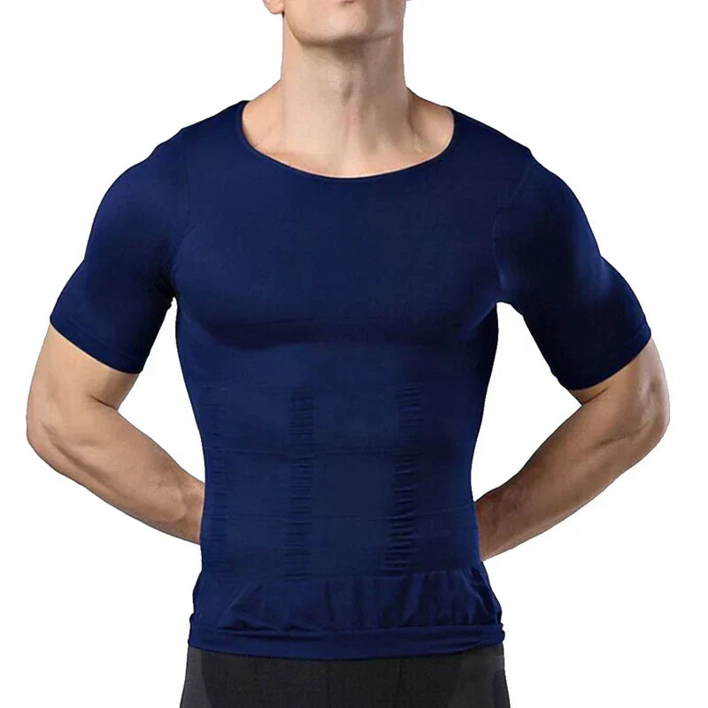 Man in the navy compression top with hands on hips, showing the snug fit across the chest and ribbed stomach panels. 7