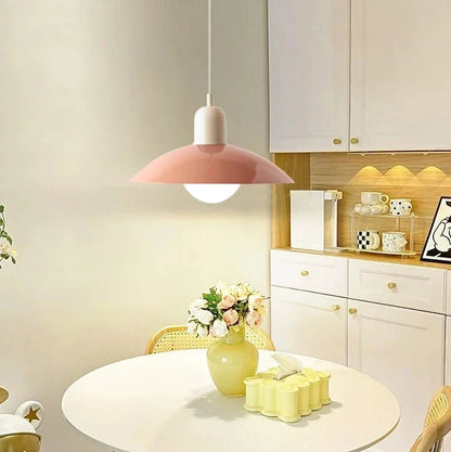 Pink pendant with white cap above a round white table with roses, in a kitchen 8