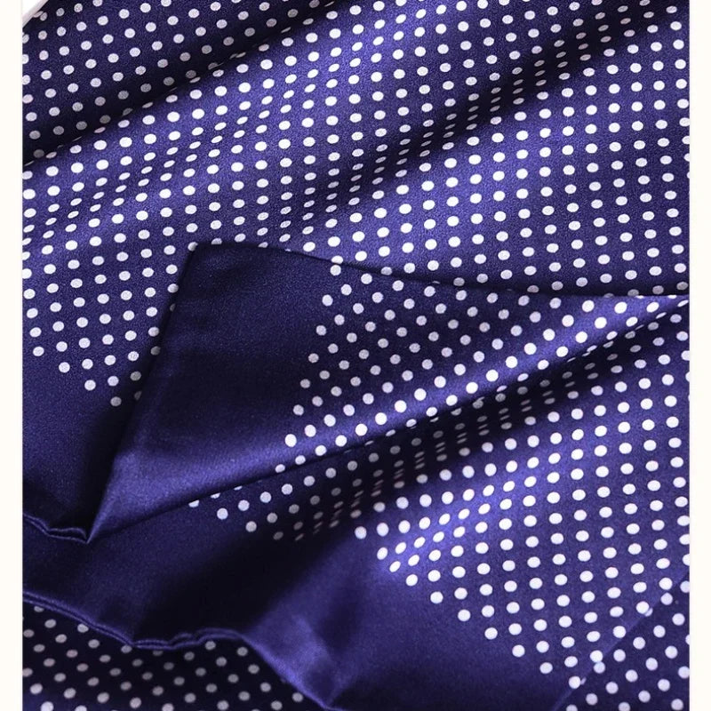 Close-up of the navy silk fabric with white polka dots, showing the glossy sheen and a folded plain navy edge. 27