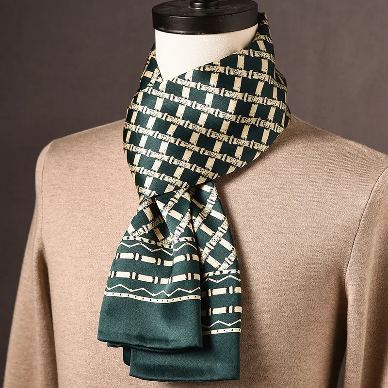 Dark green silk scarf with a cream lattice pattern and a bamboo-style border, draped on a mannequin wearing a beige jumper. 19