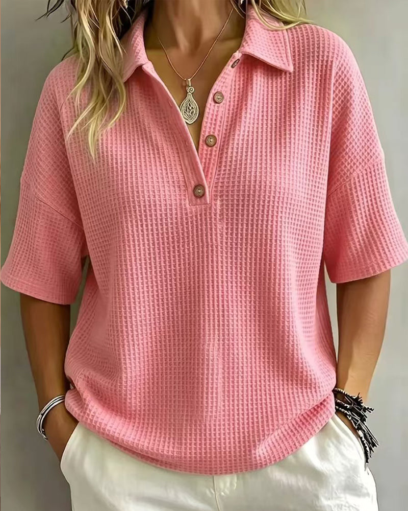 Model wearing the bright pink waffle knit polo top with brown buttons and drop shoulders 9
