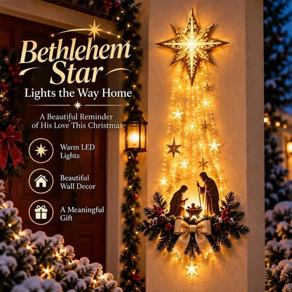Glowing star with cascading light strands and nativity scene on a porch wall at dusk 1