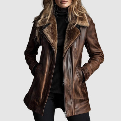 Front view of the brown leather jacket worn open over a black roll-neck, hands in pockets 1
