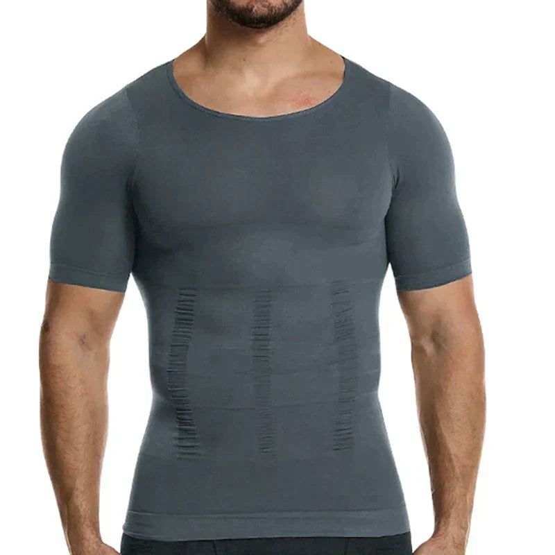 Man wearing the grey compression top, front view, showing the close fit and ruched shaping lines down the stomach. 6