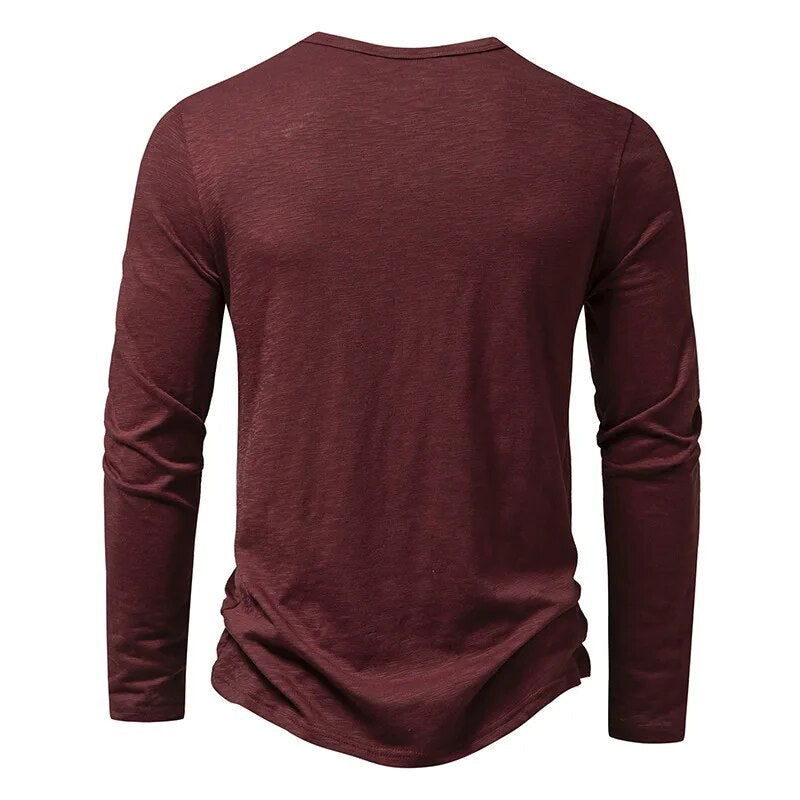 Back view of the burgundy long-sleeved Henley, with a plain back and round neckline. 13