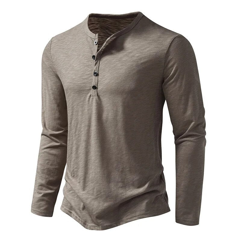 Taupe-grey long-sleeved Henley shown at a three-quarter angle, with dark buttons on the placket and a curved hem. 2