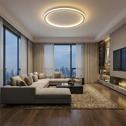 Ring ceiling light lit in a spacious modern living room with a cream sectional sofa, marble table, fireplace and city view. 7