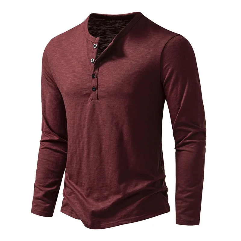 Burgundy long-sleeved Henley shown at a three-quarter angle, with four buttons on the placket and a curved hem. 12