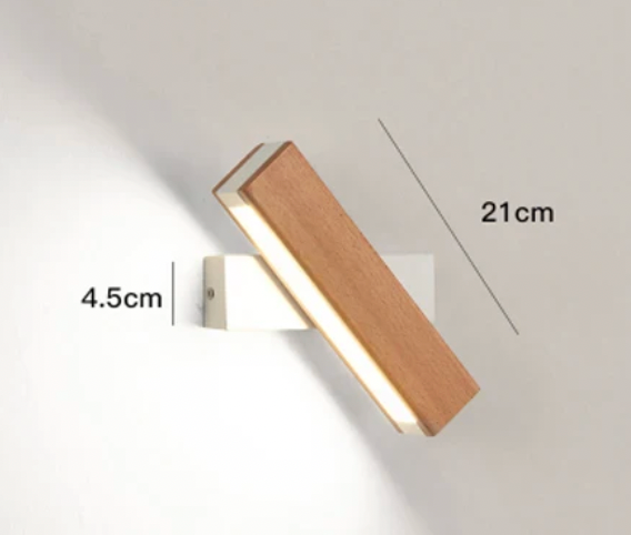 Shorter wooden light with a white base, turned at an angle, with size markings of 21cm and 4.5cm. 4