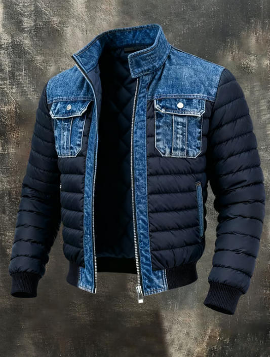Full front view of the jacket, unzipped, with dark navy padded body, blue denim collar, yoke and chest pockets, and ribbed cuffs. 1