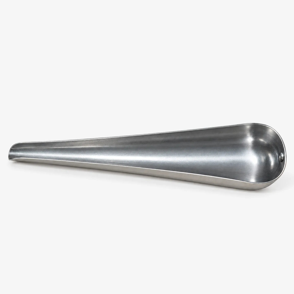 Empty tapered metal scoop lying on its side, showing the wide bowl at one end and the narrow pouring tip. 4