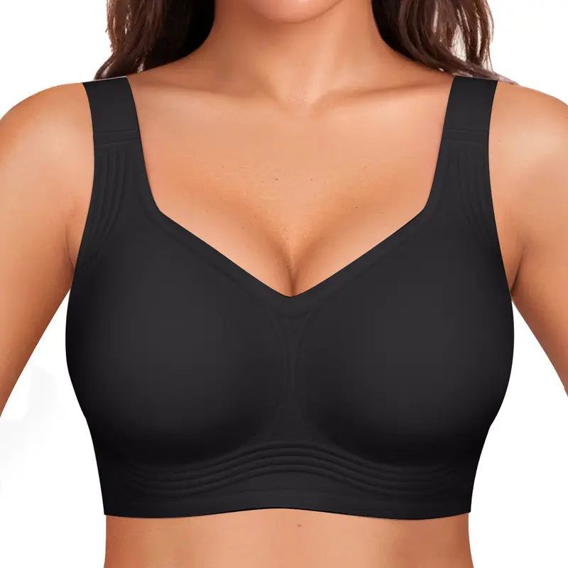 Front view of a black seamless bra with wide straps and ribbed lower band, worn by a model 2