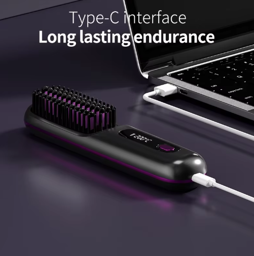 Black brush lying flat with a charging cable plugged into its end and the other end connected to a laptop. 6
