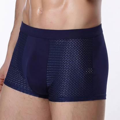 Close-up of a man's torso wearing navy boxers with a plain centre and breathable mesh side panels 5