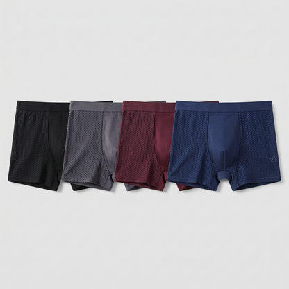 Flat lay of four boxers in black, grey, burgundy and navy, each with perforated mesh side panels 3