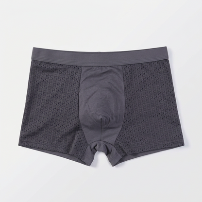 Single grey boxer shorts laid flat, front view, with a smooth centre panel and mesh sides 6