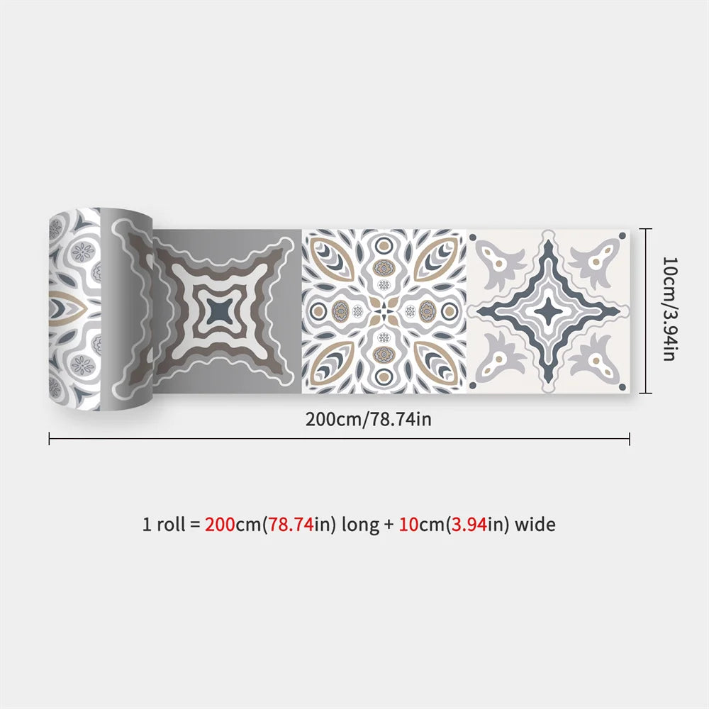 Partly unrolled strip of ornate patterned tiles in grey, white, taupe and slate blue 60