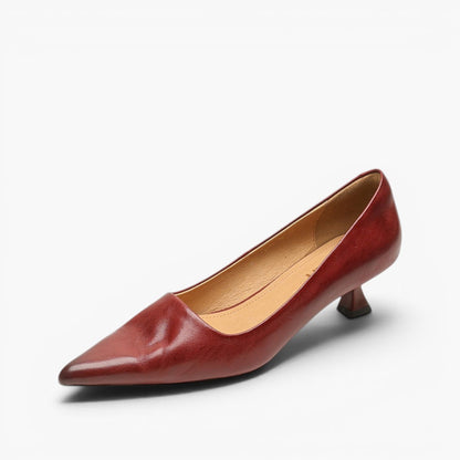 Single deep red leather pointed-toe kitten heel angled on a plain white background 7