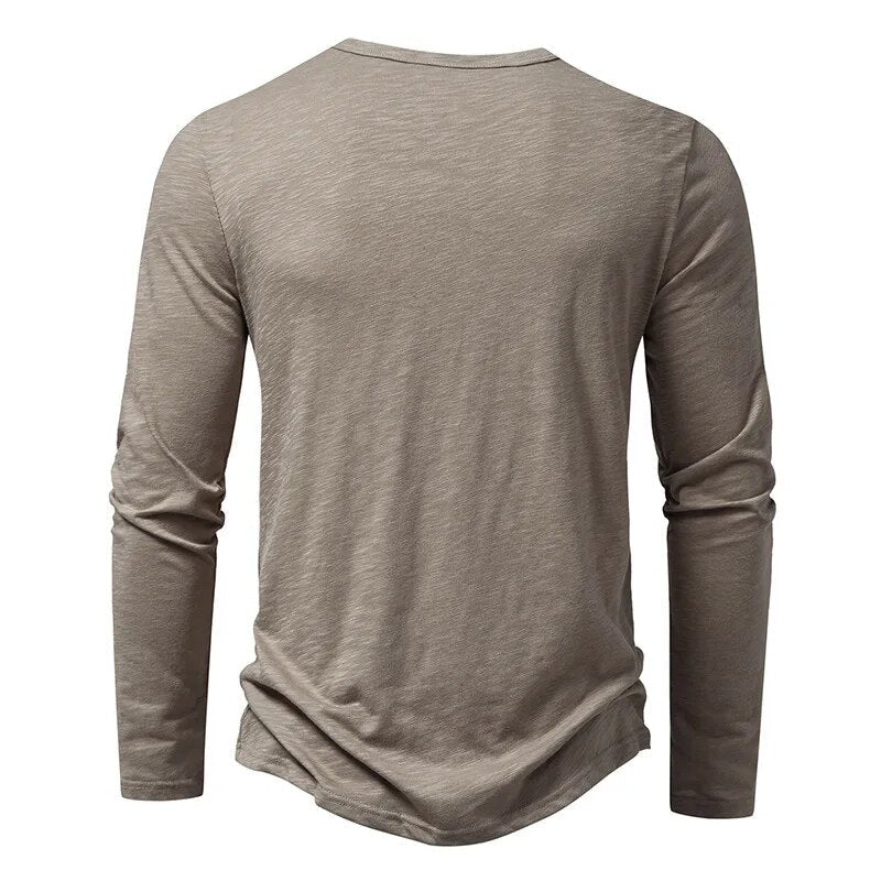 Back view of the taupe-grey long-sleeved Henley, showing the plain back and round neckline. 3