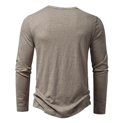 Back view of the taupe-grey long-sleeved Henley, showing the plain back and round neckline. 3