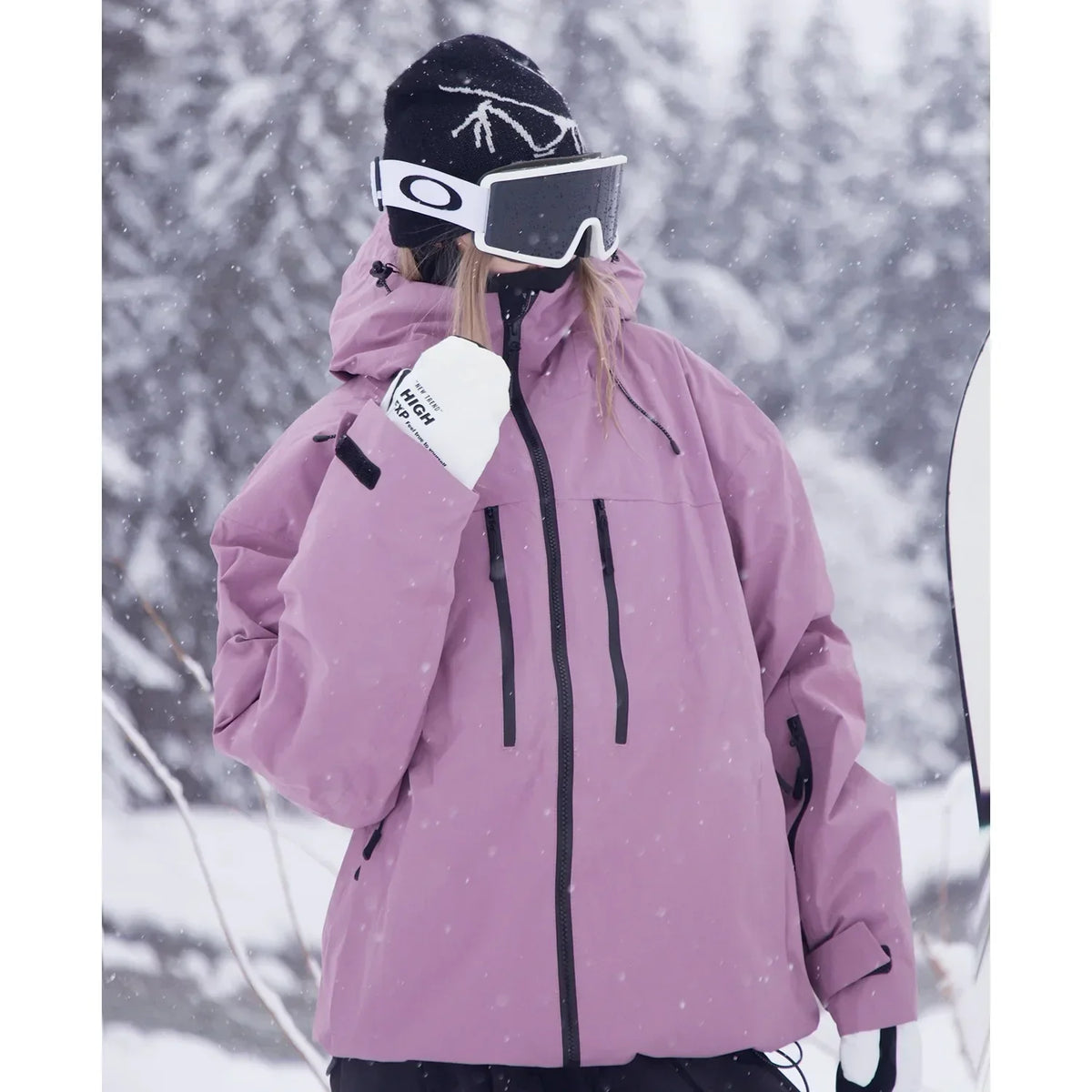 Close three-quarter view of the dusty pink jacket, showing chest zip pockets, drawcord hood and sleeve cuff strap. 4