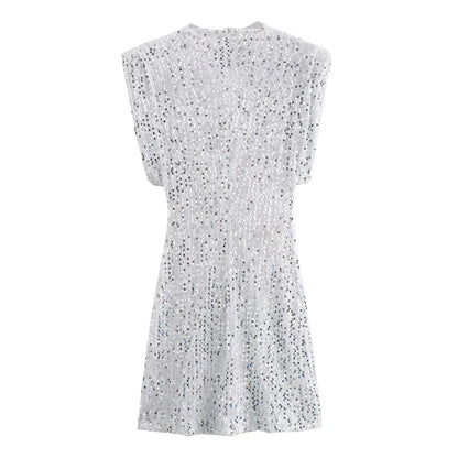 Back view of the white sequinned mini dress, laid flat on a white background 16