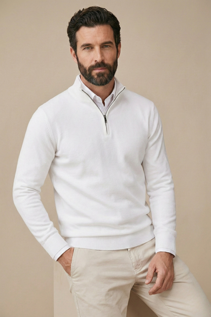 Model in the white half-zip jumper with a hand in his trouser pocket, three-quarter pose 3