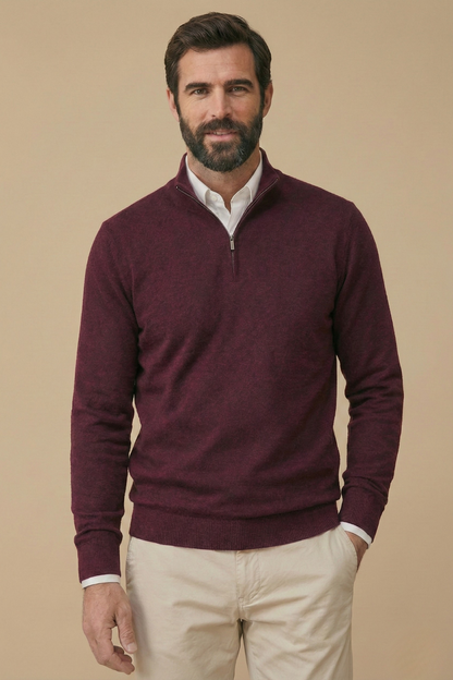 Smiling model wears the burgundy half-zip jumper over a white shirt, with one hand in his pocket 4