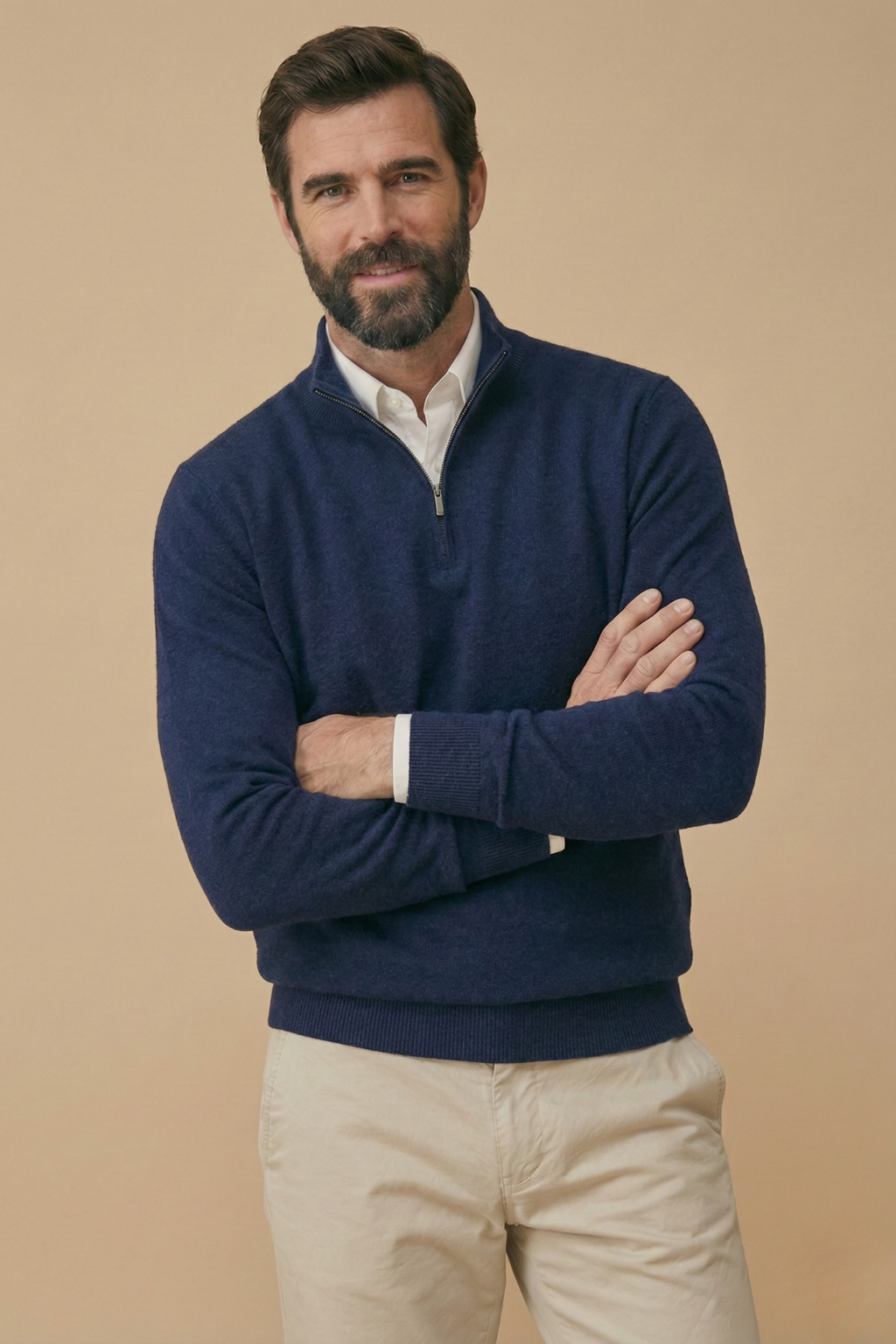 Model with folded arms wears the navy half-zip jumper, showing the ribbed cuffs and hem 5