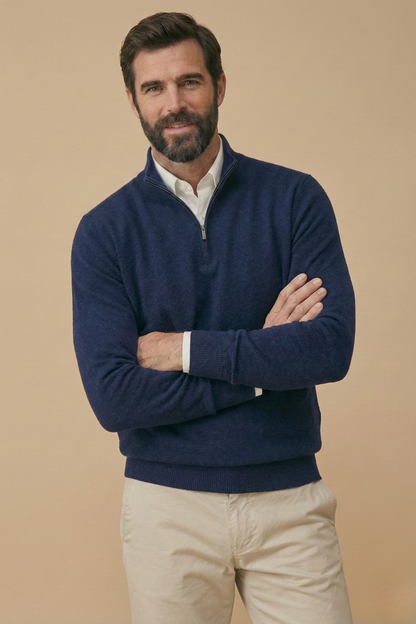 Model with folded arms wears the navy half-zip jumper, showing the ribbed cuffs and hem 5