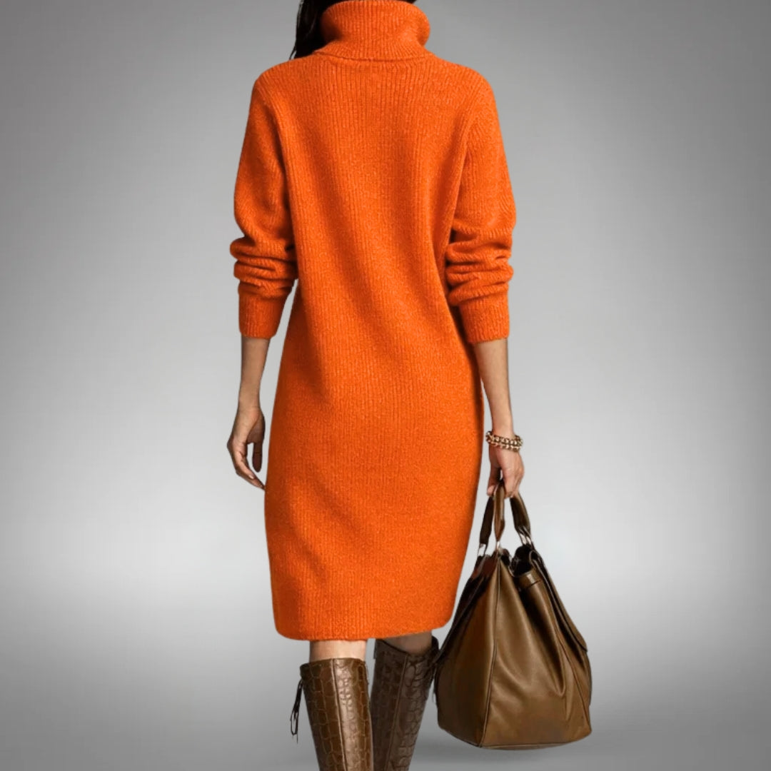 Back view of the orange knitted dress with a high roll neck, worn with brown boots 3