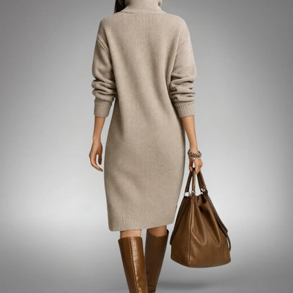 Back view of the beige ribbed knit dress with a roll neck, worn with tall brown boots 7