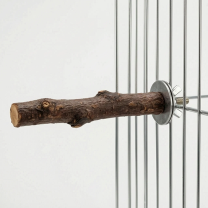 Side view of the bark-covered perch attached to cage wires, showing the cut end and the metal bolt fitting. 5