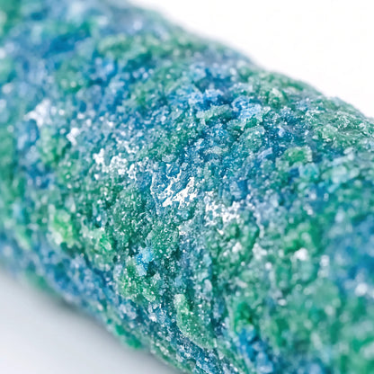 Extreme close-up of the pole's rough, granular surface in mottled blue and green, showing the gritty texture. 4