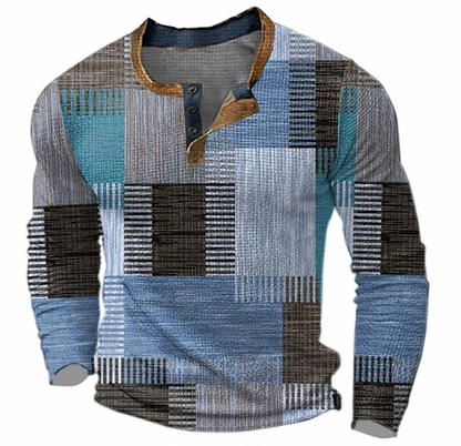 Front view of the long-sleeved Henley top in blue, teal, brown and grey geometric blocks with three-button placket and tan collar. 3