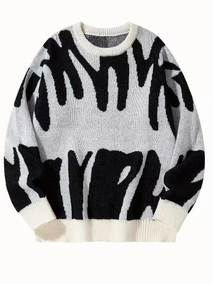 Flat-lay knit jumper in off-white with black abstract pattern and cream ribbed cuffs 6
