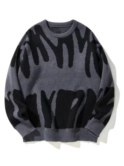 Flat-lay knit jumper in grey with bold black abstract pattern and ribbed cuffs 1