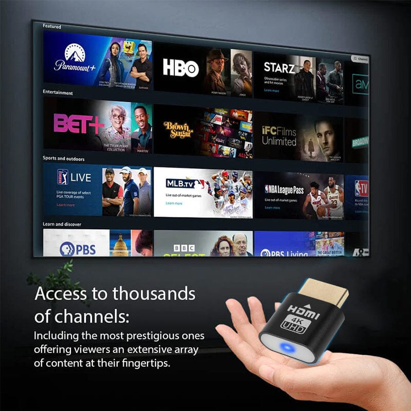 Hand holding the black HDMI plug in front of a television showing a menu of streaming channels and sports tiles. 5