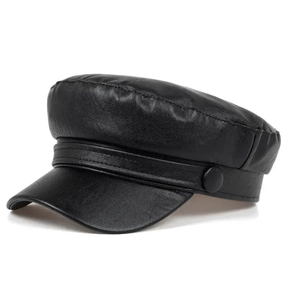 Black faux leather baker boy cap seen from the front three-quarter angle 2