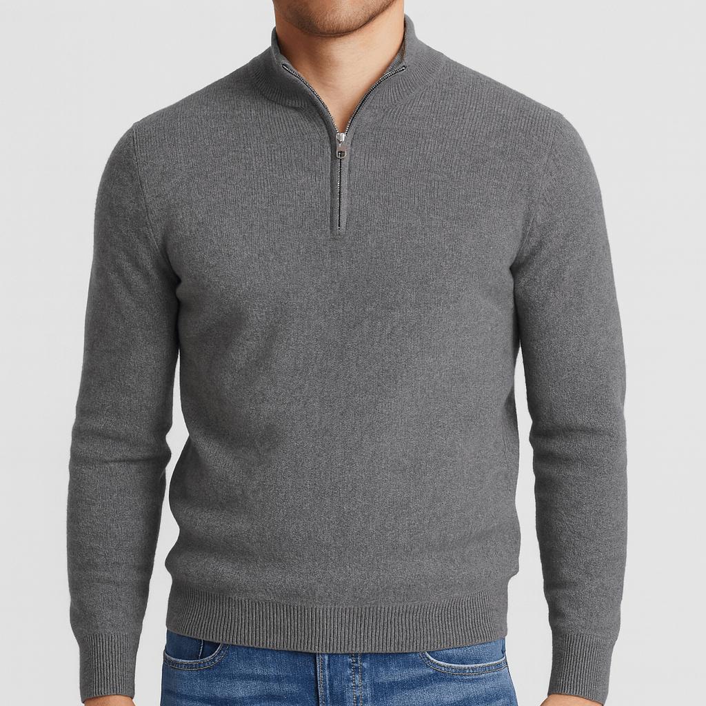 Model wearing the quarter-zip jumper in marl grey with a silver zip and ribbed cuffs, paired with blue jeans. 4