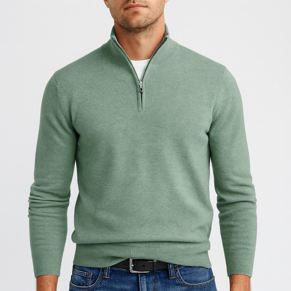 Second view of the sage green quarter-zip jumper on a model, with the zip partly open at the neck. 12