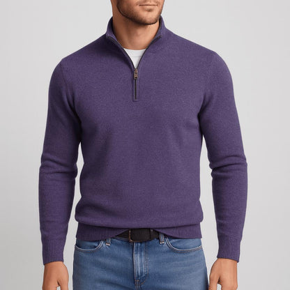 Model wearing the quarter-zip jumper in deep purple with a bronze-toned zip, black belt and blue jeans. 8