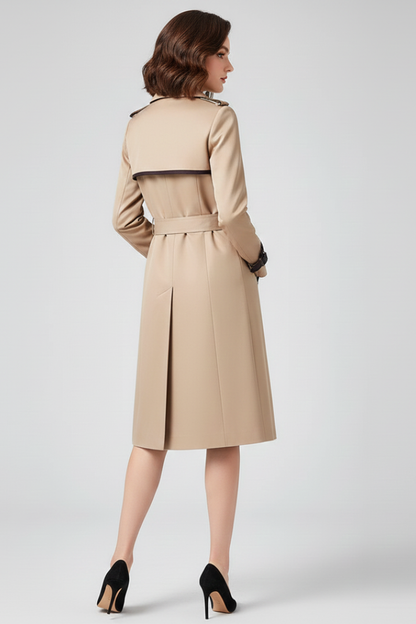 Back view of the beige trench coat on a model, showing the piped yoke, belted waist and centre back vent. 4