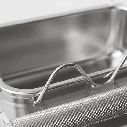 Close-up of the stainless steel tray, curved wavy clear divider and textured metal perch bar. 3